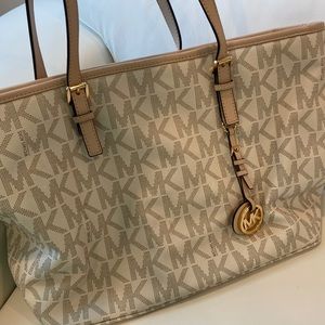 Michael Kors tote bag- very good cond.. A few minor stains- inside of lining.